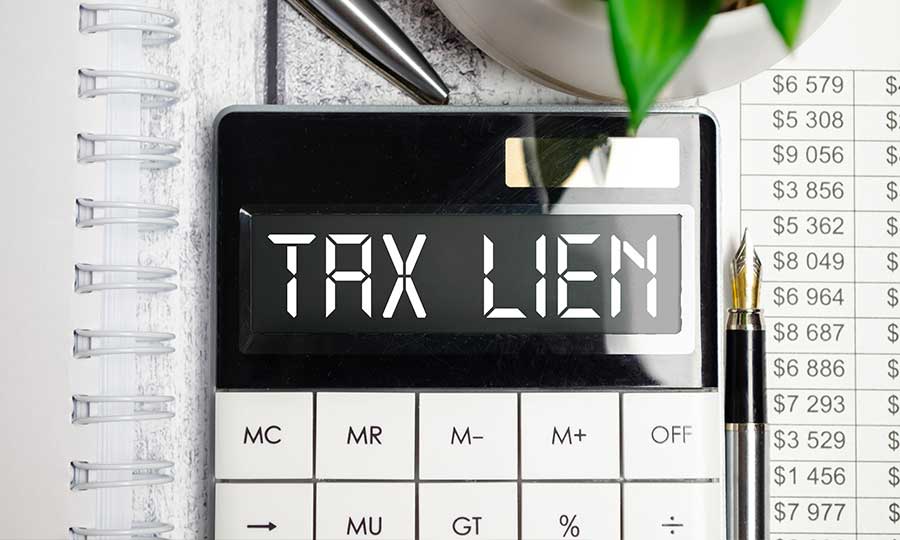 A calculator spelling out tax lien